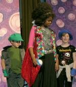 Addaperle (Taylor Wilson) amongst the Munchkins Dorothy