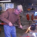 EnglishGardenerSharpensShovel