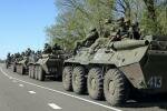 Russian servicemen in armoured personnel carriers on the outskirts of Belgorod near the Russian-Ukrainian border April 25, 2014. Photo by REUTERS/Alexander Mikhailov RussianSold