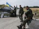 Ukrainianian National Guard members at checkpoint near the town of Slavyanoserbsk, in Luhansk region as captured by Gleb Garanich, REUTERS UkrainTroops